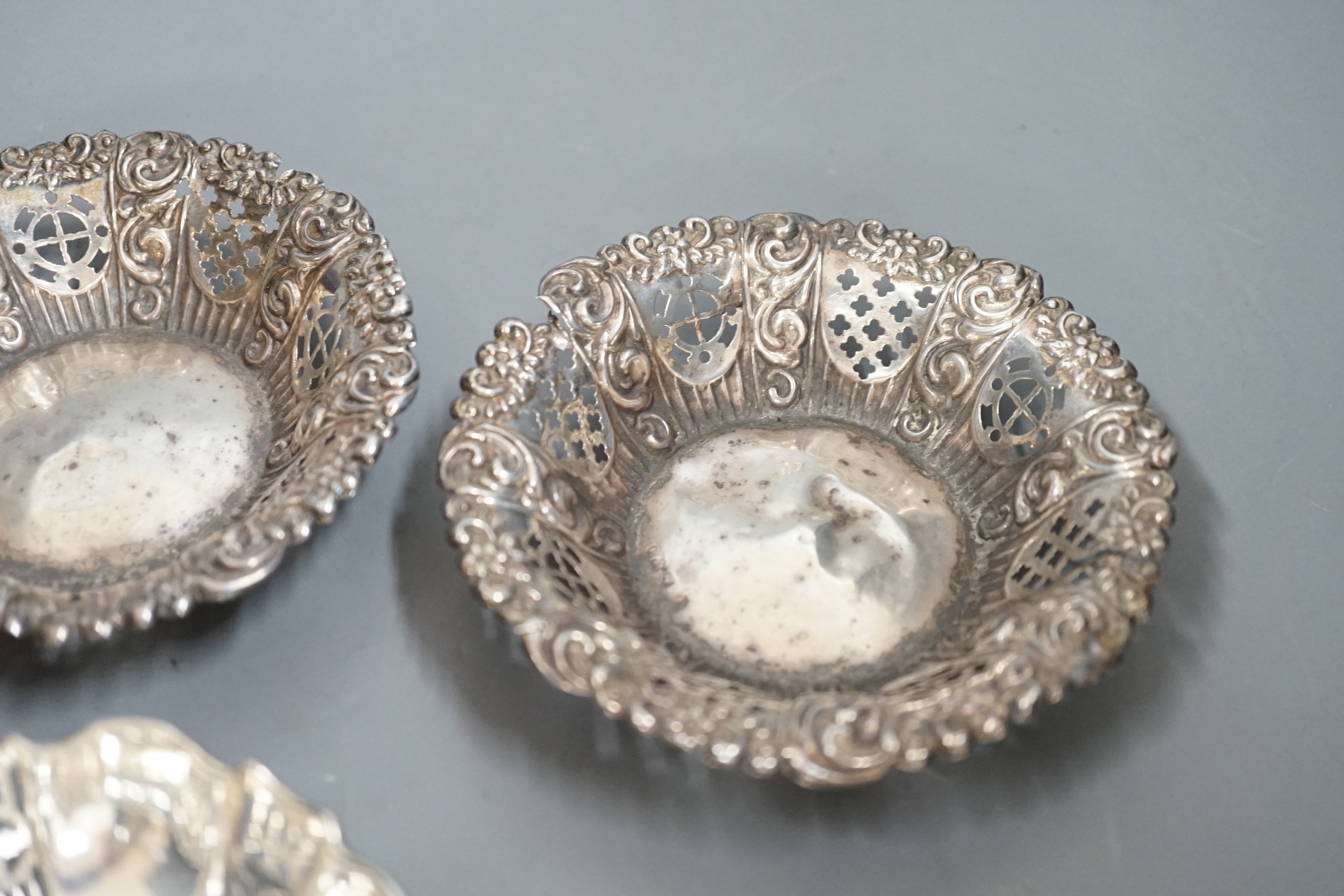 A late 19th/early 20th century repousse silver rose bowl, marks rubbed, diameter 12.6cm and two pairs of silver bonbon dishes.